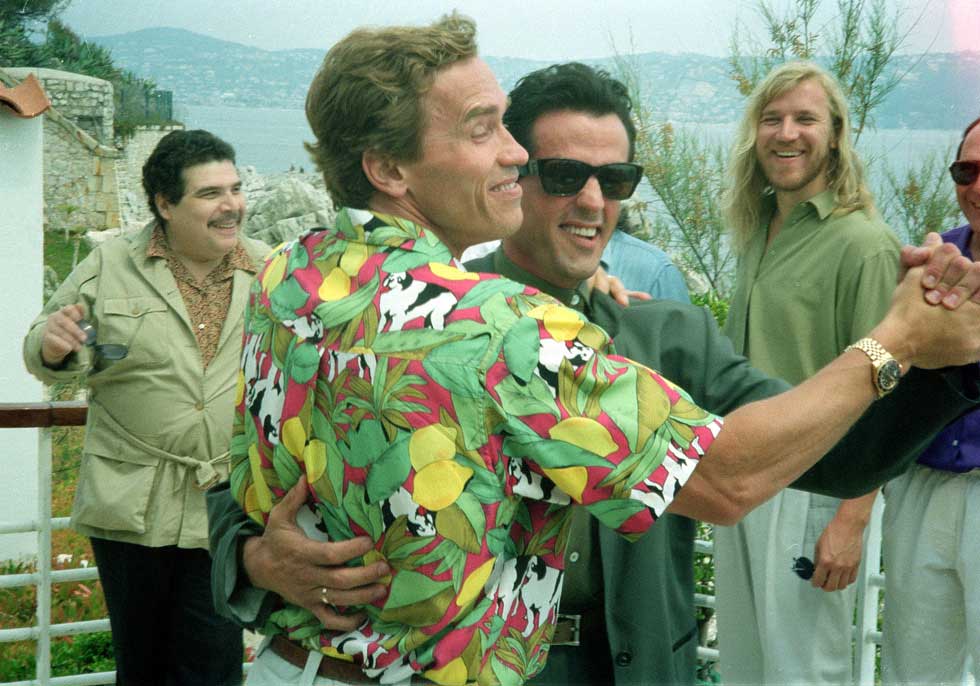 Arnold Schwarzenegger dancing with Sylvester Stallone in Cannes, 1990.
