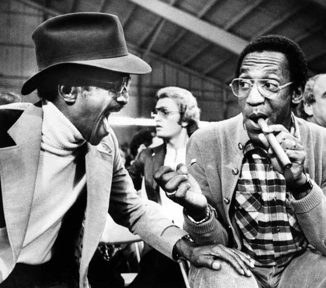 Sammy Davis Jr. having a laugh with Bill Cosbyat a boxing match in Las Vegas, 1979.