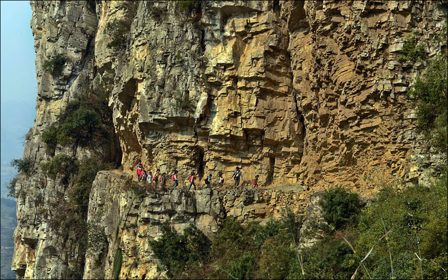 5-hour long walk to school along a narrow mountain path in the mountains of China.