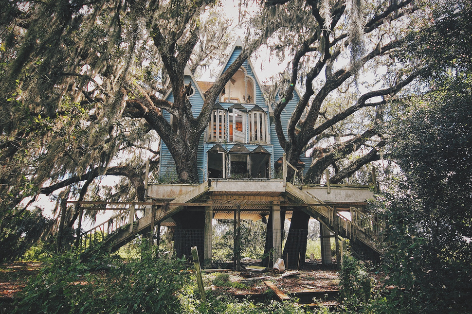 An abandoned child-sized Victorian-style tree house. Florida