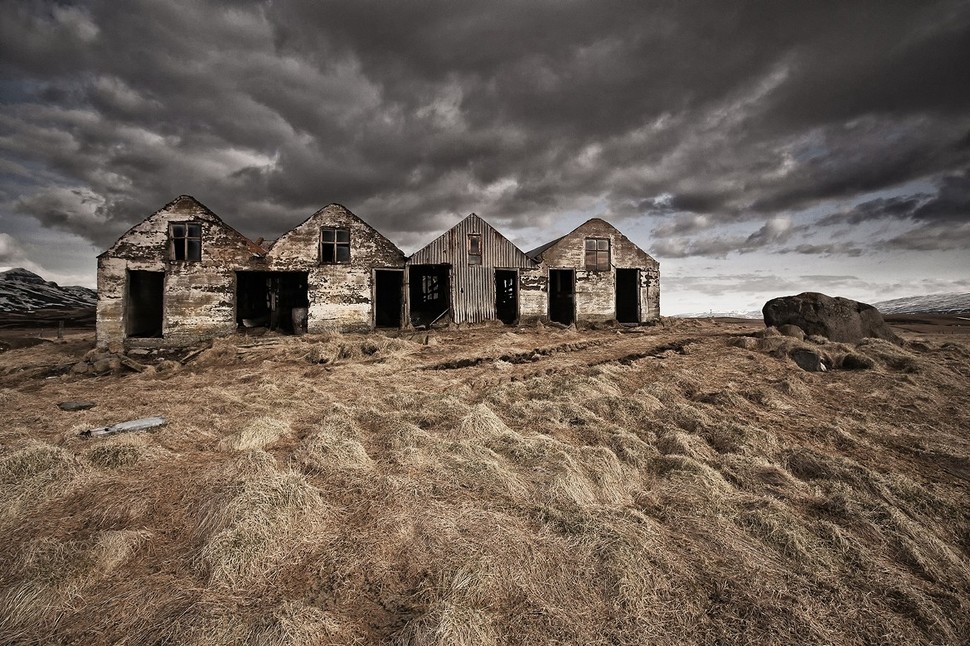 A row of abandoned and graffitied houses. Iceland