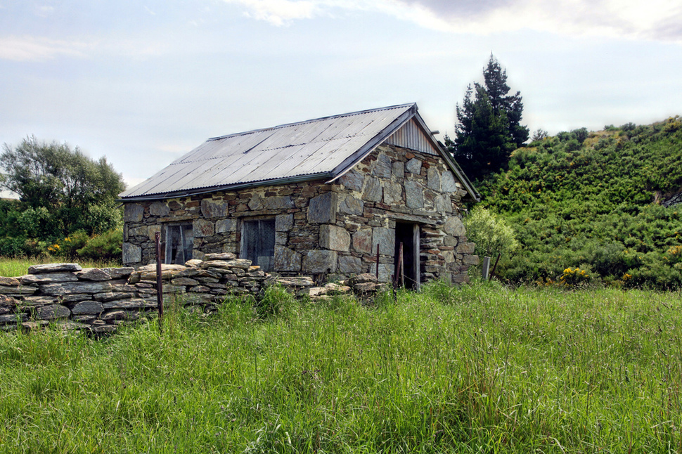 This simple stone shack was once home to some of the first European settlers of New Zealand. Deepdell, Macraes Flat, Otago, New Zealand