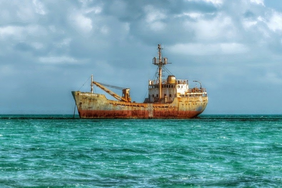 La Famille Express Provo, Caribbean Sea - In 2004, in the midst of Hurricane Frances, this freighter broke loose and moored on an area of reef.
