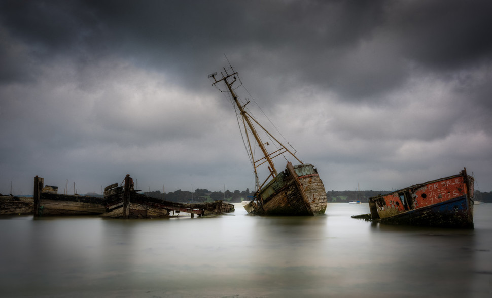 Sinking sail boats River Orwell, Pin Mill, Suffolk, United Kingdom