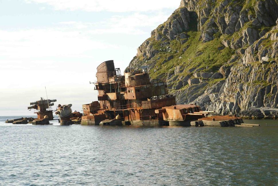 Murmansk Sorvaer, Norway - Following the fall of the USSR, this 1955 cruiser was sold for scrap to India in 1994 but ran into difficulties off the Norwegian village of  Sorvaer. This relic of the past was removed in 2013 following fears that it contained nuclear material.