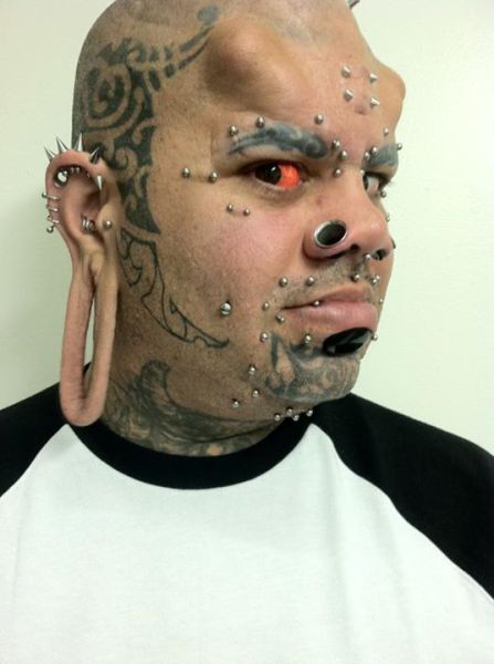 He even split his own tongue using dental floss, and has bolt holes on his forehead with spikes screwed in.