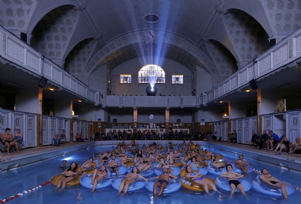 People attend the screening of the film "Jaws" by director Steven Spielberg, screened at Strasbourg public baths during the European Fantastic Film Festival, in Strasbourg