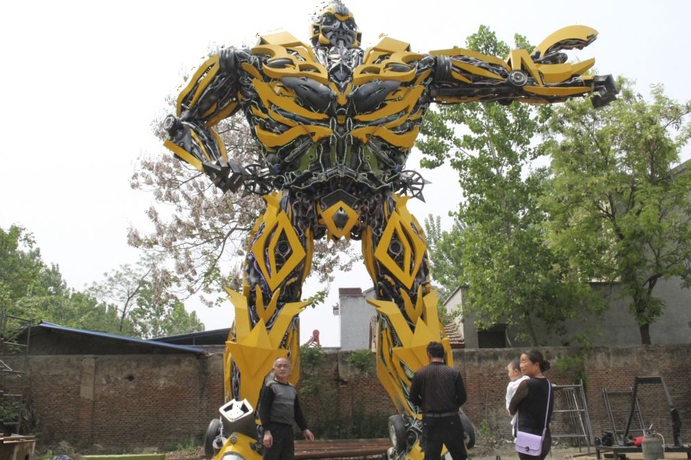People look at a replica of a "Transformer", made by a fan, in Shangqiu