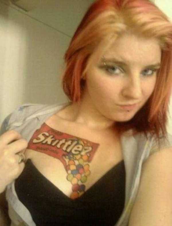 girl with a tattoo of Skittles pouring into her cleavage.