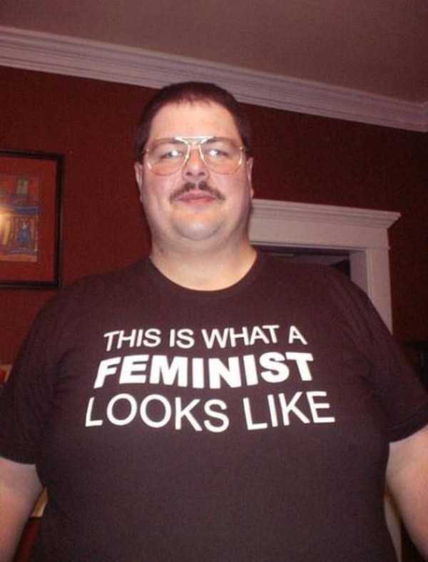 Large man with shirt that says This Is What A Feminist Looks Like