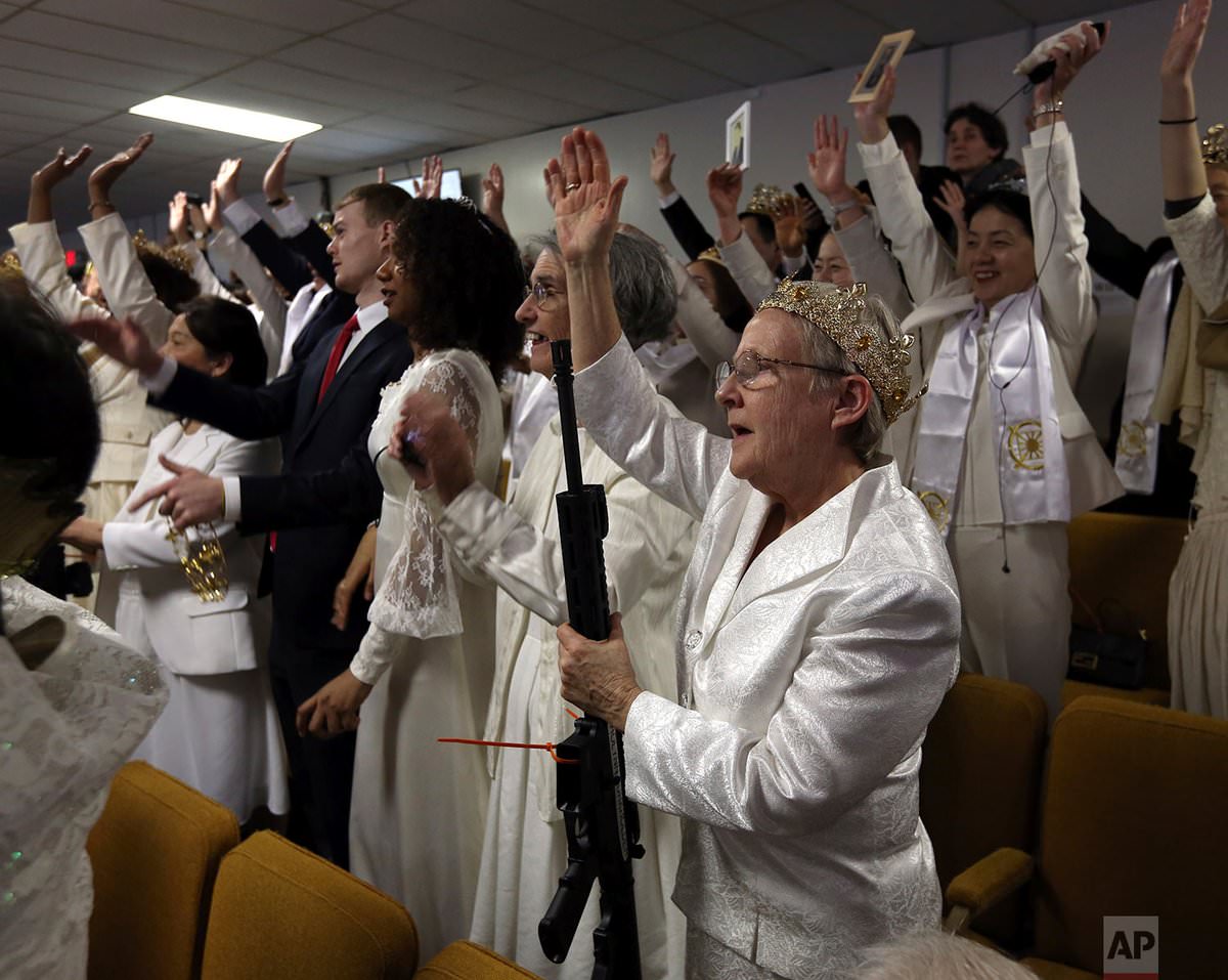 Tim Elder, Unification Sanctuary's director of world missions, told worshippers the ceremony was meant to be a blessing of couples, not "inanimate objects," calling the AR-15 a "religious accoutrement."