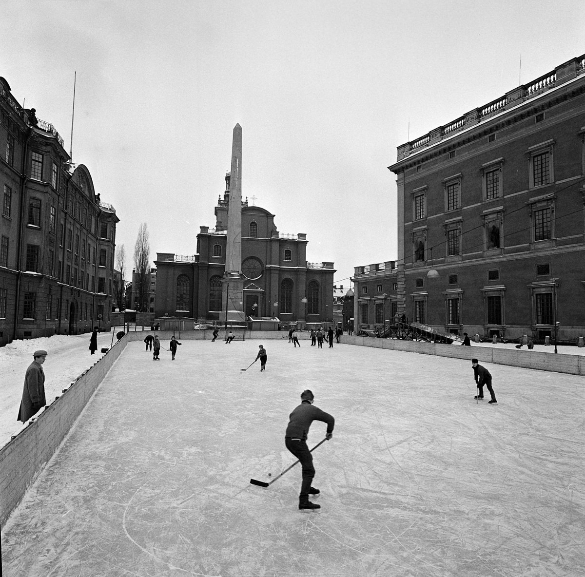 Children play hockey on a natural ice rink in Stockholm, Sweden in 1950.