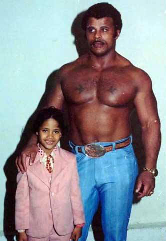 Look at tiny Dwayne The Rock Johnson, junior, with Rocky Johnson, senior, also an awesome pro-wrestler.