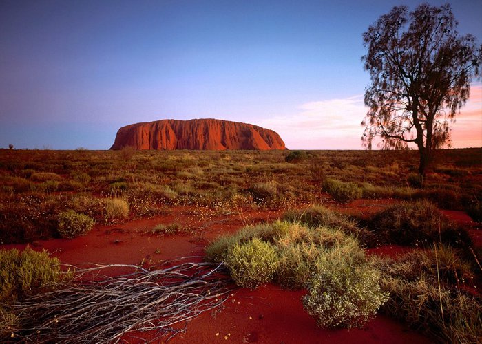 Uluru, or Ayers Rock, is a massive sandstone monolith in the heart of the Northern Territory’s arid "Red Centre". Uluru is sacred to indigenous Australians and is thought to have started forming around 550 million years ago.