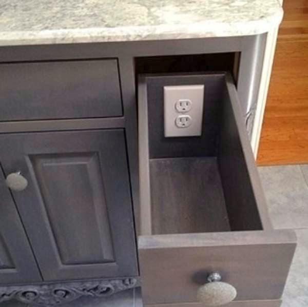 Add outlets to drawers to keep clutter off of the table top.