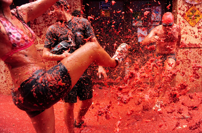 10. La Tomatina  Buol, Spain. As crazy as it may seem, these festivals are held every year purely for fun, meaning it isnt tied to any ancient traditions. In 1945 a few locals began throwing fruits and vegetables during a parade  and ever since then the tomato-throwing festival has continued on.