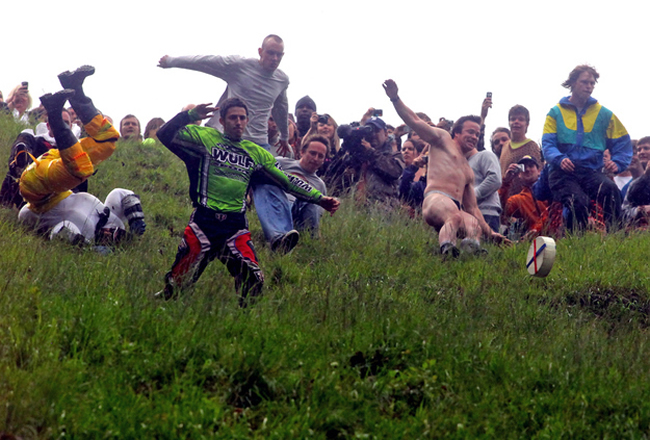 12. Cooper Hills Cheese Rolling Festival  Gloucester, England. If youve ever wanted to watch hundreds of men run down a hill while chasing a wheel of cheese, then youre in luck  because the Cooper Hill Cheese Roll not only exists, its quite the romp.