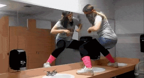 gifs - woman  dances on top of a sink and slips