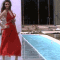 gifs - woman in a fashion show falls into a pool