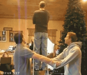 gifs - man falls onto arms of two men and they drop him