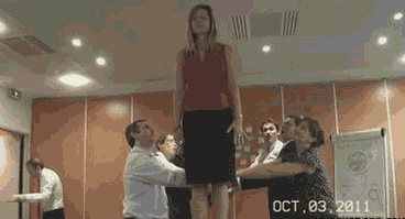 gifs - woman falls back and no one catches her