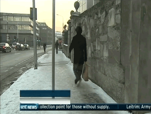 gifs - man slips on pavement from snow