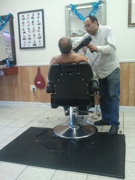 This barber, who is undeniably committed to his craft.