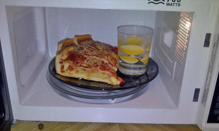 Keep your crust crispy by microwaving your left over pizza with a cup of water