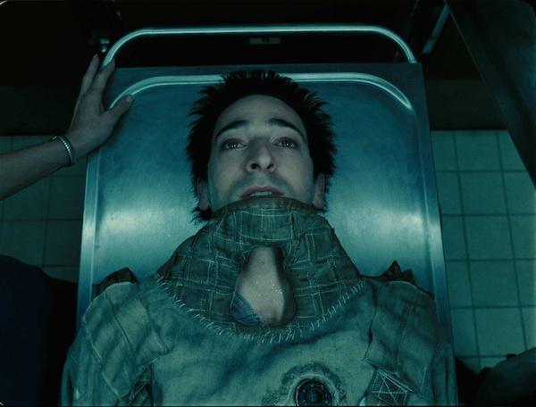While filming The Jacket Adrien Brody insisted on being locked inside a straight jacket and placed inside a morgue drawer in-between scenes.