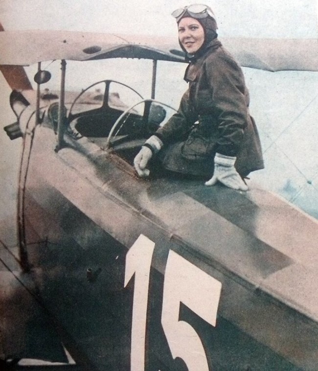 Sabiha GÃ¶kÃ§en of Turkey poses with her plane, in 1937 she became the first female fighter pilot.