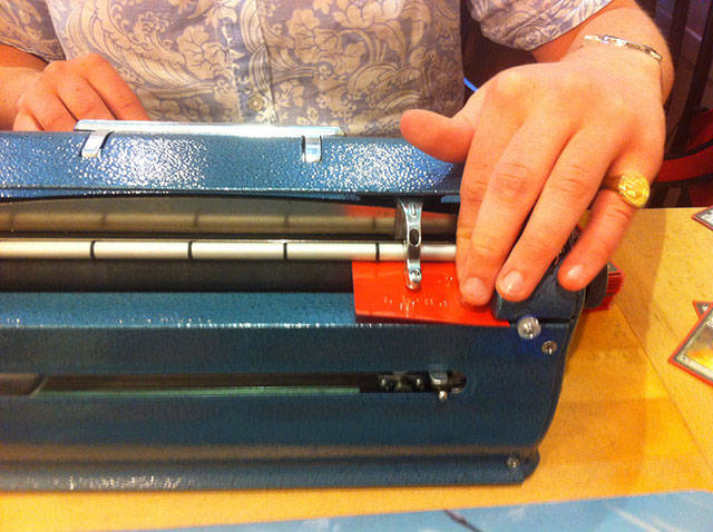 The printer is surprisingly light and portable but is a completely mechanical machine that works in pretty much the same was as a traditional type writer but with fewer buttons which Richard often presses in collections in order to produce certain letters or words.

Reading the sleeves to check what he’s already type