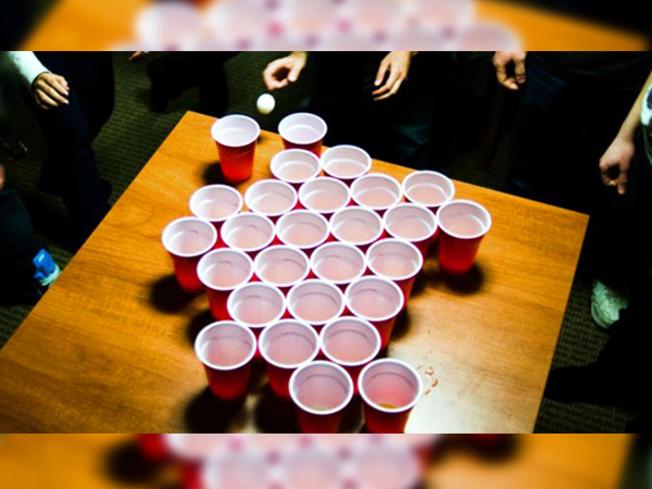 Rage Cage

Configure the players in a ring around the table. Pick two players standing across from each other to start. They must each drink one of the beer filled cups, and proceed to bounce a ping pong ball inside of the empty cup. Once accomplished, they will pass the cup, and the ball clockwise to the next player.