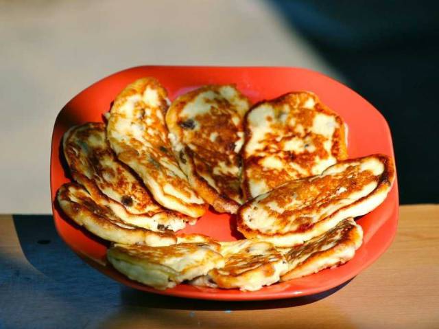 RUSSIA: Traditional breakfast is sirniki, or baked farmers cheese pancakes, and hot oatmeal. Rye bread is another staple.
