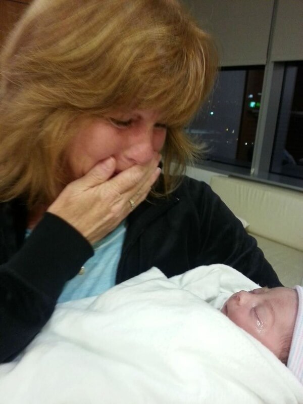 Grandma holding her grand baby for the very first time