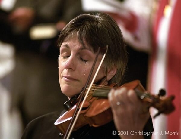 Honoring the lives lost in 9/11 – a violinist crying during her performance