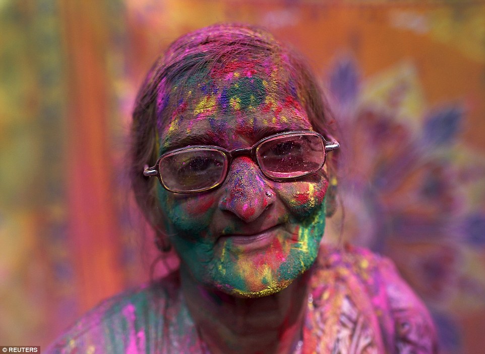 A widow celebrating the Holi festival in India.