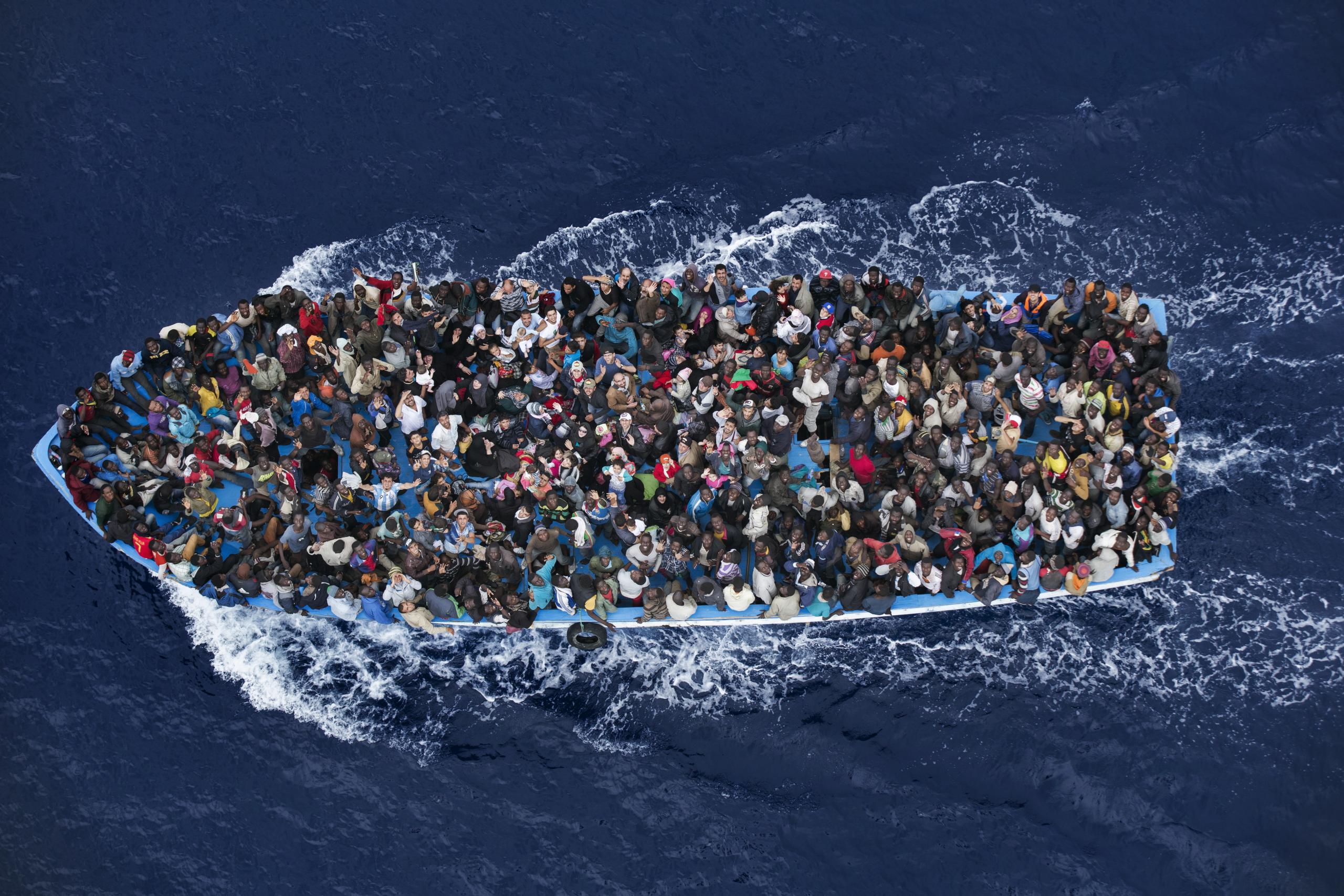 Shipwrecked refugees being rescued close to Lybia.