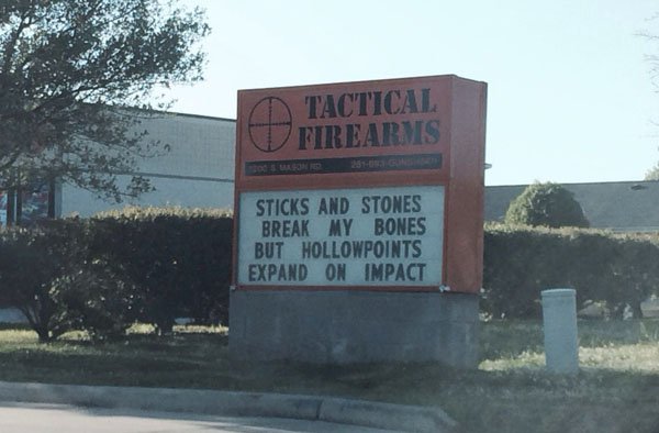 Gun store with sign about famous poem about bullying modified for gun lovers.