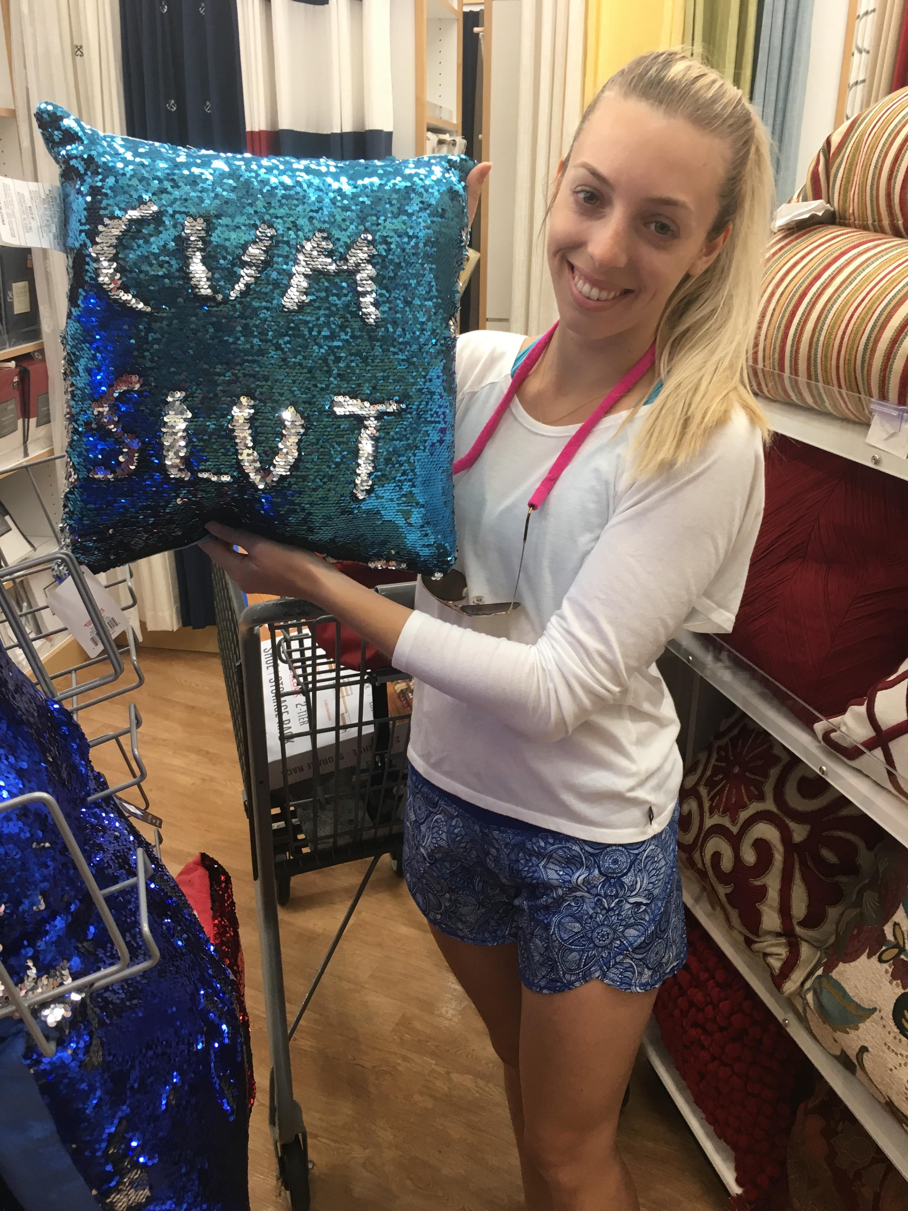 Woman holding a funny pillow