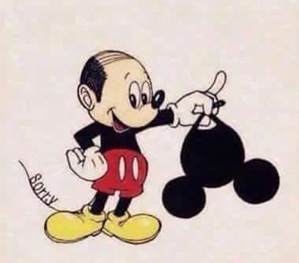 balding Mickey Mouse takes off the hat ears.