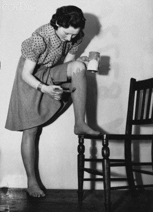 women painting legs nylon