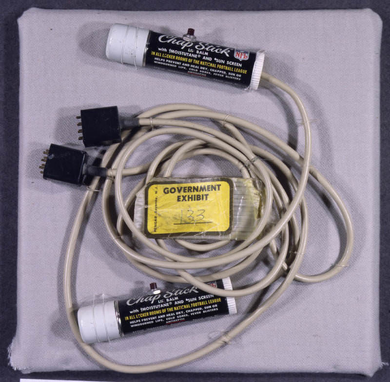 A Watergate Listening Device -These Chapstick tubes outfitted with tiny microphones were discovered in E. Howard Hunt's White House office safe during the Watergate investigation. They were used for clandestine operations for the Nixon administration, including contact with the burglars by transistor radio. They are now FBI property.
