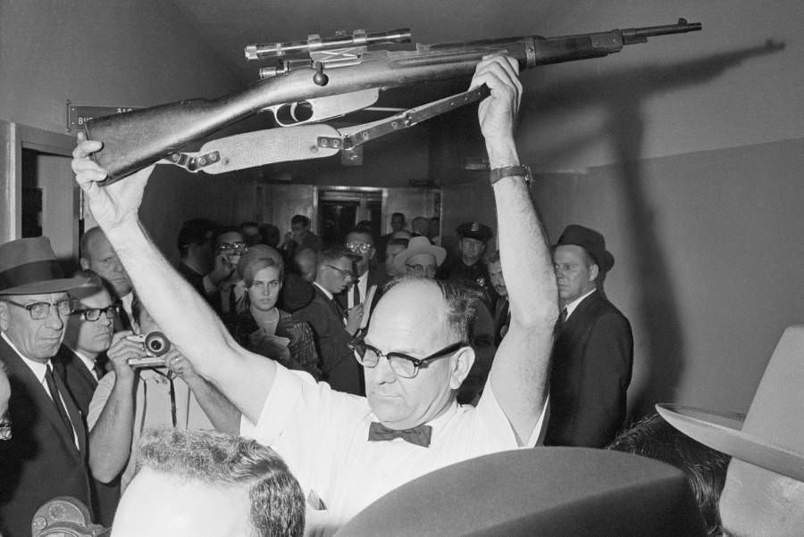 The Rifle That Killed JFK -A Dallas policeman holds up the rifle that Lee Harvey Oswald allegedly used to kill President Kennedy. It is officially accepted that Oswald smuggled this gun into the Texas School Book Depository on the morning of the assassination, Nov. 22, 1963, and shot President John F. Kennedy with it. The National Archives facility in College Park, Md. has it now.
