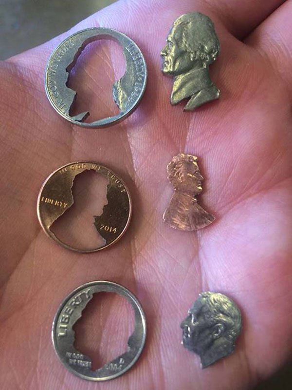 funny picture of a nickel penny and dime with the heads cut out very precisionly
