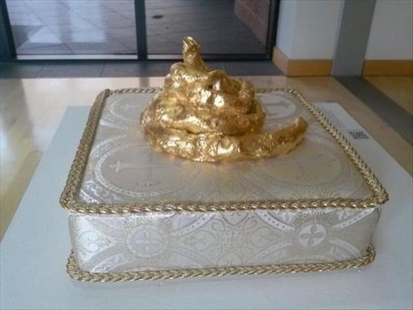 funny picture of a golden poop pillow cake
