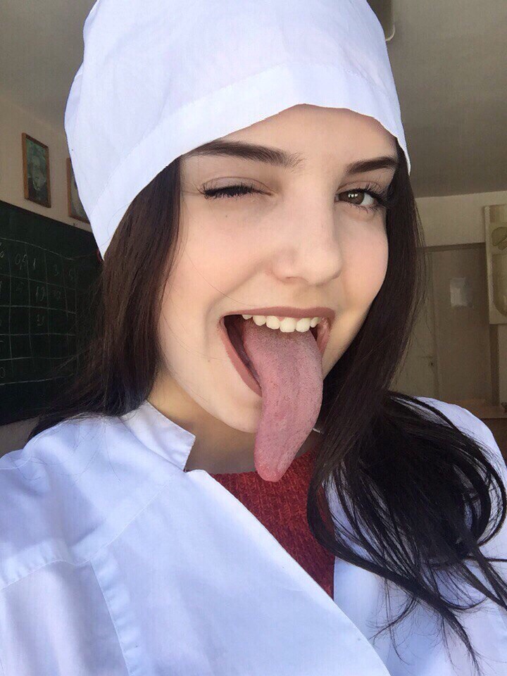 cute picture of girl showing off her very long tongue