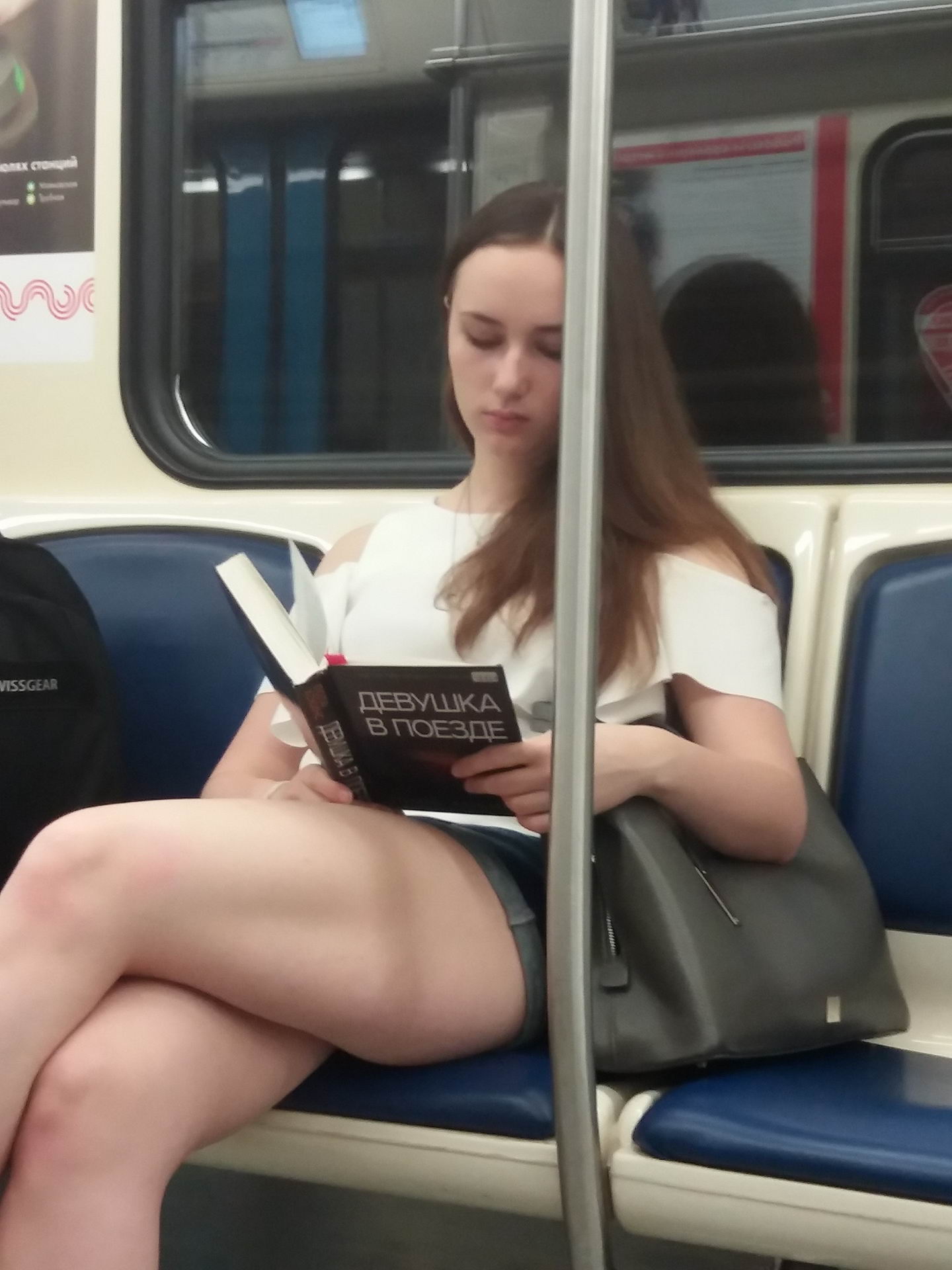 Girl on a train reading "Girl on a train"