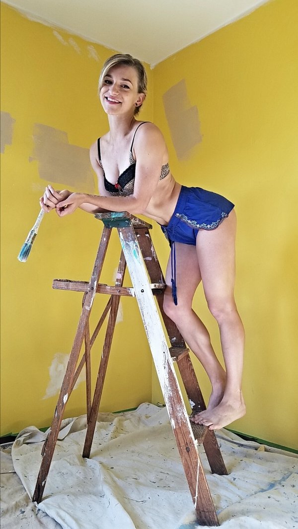 hot girl in short shorts on a ladder