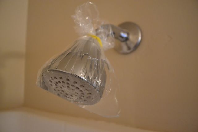 Shower Head Saver - Shower head covered with nasty hard water deposits? Pour distilled white vinegar in a plastic bag and fit it over the shower head with a rubber band. Let it soak for an hour or overnight then remove the bag and wipe scum away with a cloth.