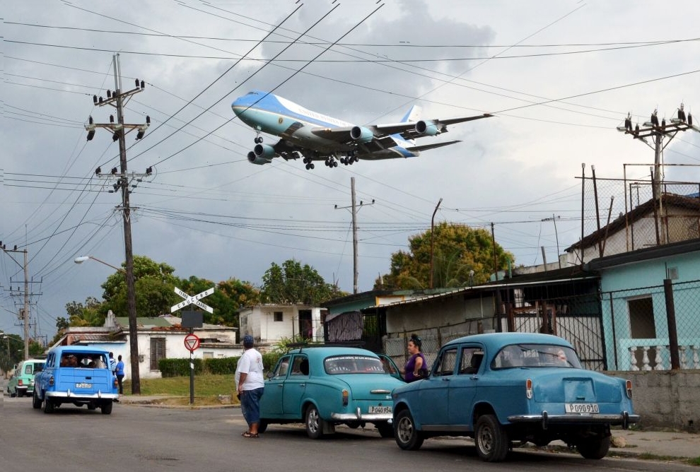 Air Force One carrying Obama and his family flies over a neighborhood of Havana as it approaches the runway to land at Havana's international airport